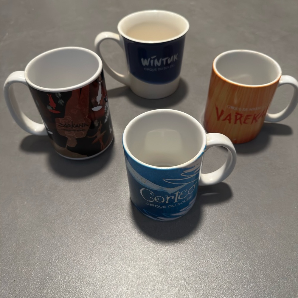 Cirque du Soleil original mug set.   
Blue and Black Ceramic Mug Set